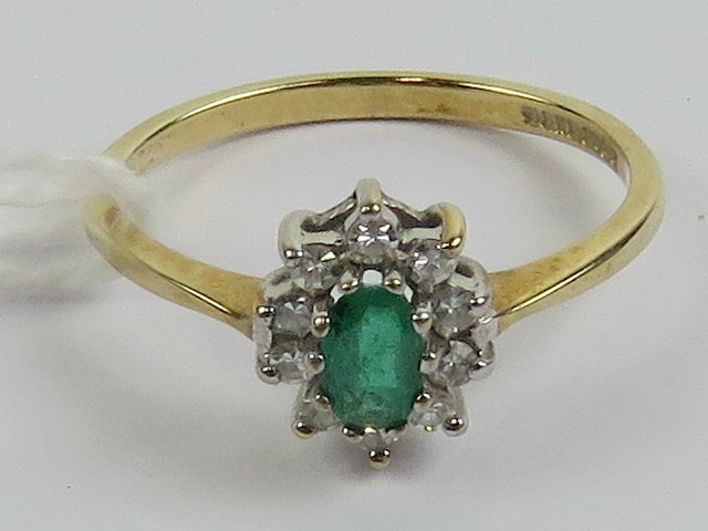 A 9ct gold emerald and diamond ring,