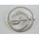 A delightful white metal diamond encrusted open swirl brooch, approx 0.66ct total diamond weight, 3.