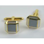 A pair of 18ct gold hematite and mother of pearl cufflinks of octagonal form, hallmarked 750, 12.2g.