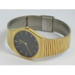 A Pulsar Quartz gold plated wristwatch having circular black ground face,