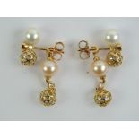 A pair of 18ct gold Sarah Ho pearl and diamond earrings, stamped 750, 5.8g.