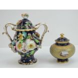 A lidded pot by Coalport having cobalt blue ground with gilding and turquoise coloured dots,