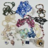 A quantity of assorted vintage costume jewellery including shell necklaces, hardstone bead necklace,