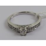 An 18ct white gold ring having central brilliant cut diamond, approx 0.