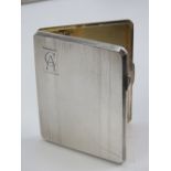 A HM silver Art Deco cigarette case of octagonal form having gilt interior and elasticated strap,