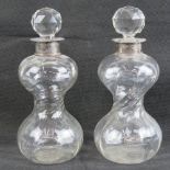 A pair of HM silver collared waisted decanters, each approx 26cm high.