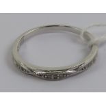 A 9ct white gold ring having rope twist pattern studded with diamonds to front, stamped 9k,
