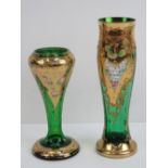 Two heavily gilded green glass Bohemian style vases having floral decoration throughout and