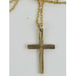 A 9ct gold cross, hallmarked 375, on 9ct gold chain, total weight 1.8g.