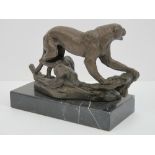 A bronzed brass figurine of a leopard raised over marble plinth base, approx 20cm wide.