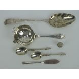 A HM silver berry spoon measuring 21cm in length having indistinct hallmarked upon (stretched) and