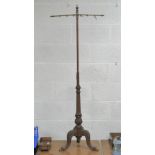 A 19th century freestanding fire screen stand having adjustable brass support,