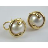 A pair of 18ct gold mabé pearl earrings with swirl yellow metal mount hallmarked 750, each approx 1.