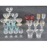 A large quantity of assorted liqueur and shot glasses.