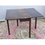 A mahogany square shaped drop leaf table measuring 96 x 110cm extended.