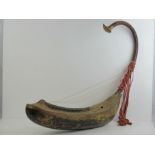 A rare 19th century Burmese garuda harp profusely carved, gilded and decorated,