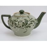 A 19th century James Macintyre and Co Ltd 'Gesso Faience' teapot in green ground having tubelined