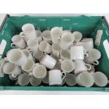 A very large quantity of identical cream ground mugs each with handle and striped decoration to lip.