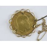 A 22ct gold Edward VII 1907 full sovereign, 8g, in 9ct gold hallmarked brooch mount.