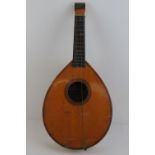 A 19th century English satinwood lute bearing handwritten label within 'Harley Maker 46 Wytch St