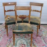 A set of three leather seated 19th century mahogany dining chairs, each raised over turned legs,