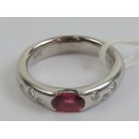 An 18ct white gold ruby and diamond ring,