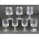A set of six (and a spare) heavy glass stemmed tumblers.