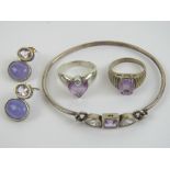 A small quantity of silver and purple stone jewellery including a bangle, pair of earrings,