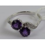 An 18ct white gold amethyst and diamond ring,