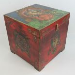 A Tibetan decorative chest having hand painted decoration throughout, 36 x 36 x 36cm,