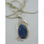 A silver and lapis lazuli pendant,