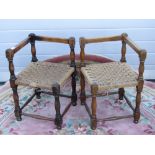 A matched pair of c1930s oak woven rush seated corner chairs, a/f.