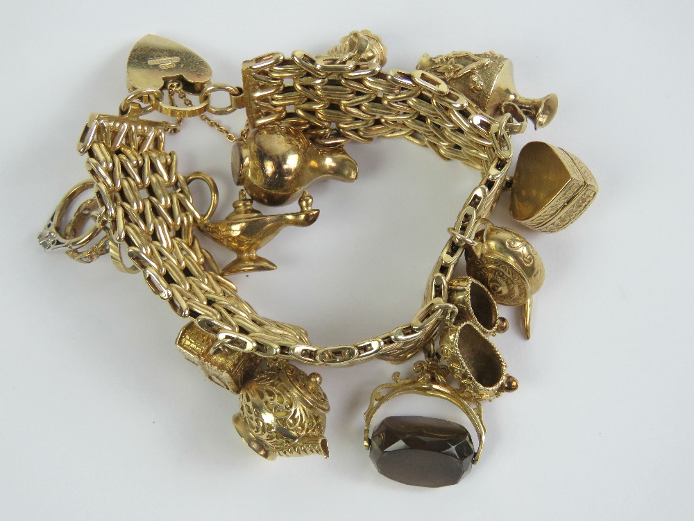 A 9ct gold charm bracelet having heavy three row bar pattern and heart padlock clasp hallmarked 375,