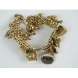 A 9ct gold charm bracelet having heavy three row bar pattern and heart padlock clasp hallmarked 375,