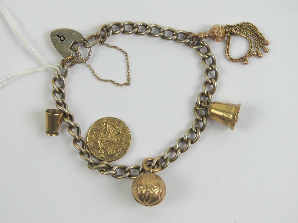 A HM silver gilt charm bracelet with heart padlock clasp,