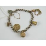 A HM silver gilt charm bracelet with heart padlock clasp,