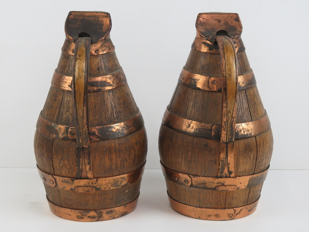 A pair of coopered oak and copper banded lidded jugs, each standing 28cm high. - Image 2 of 2