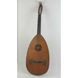 A late 19th century lute of large proportions having ivory tuning pegs and mother of pearl