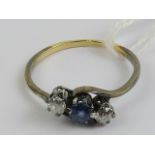 A vintage sapphire and diamond ring having central round cut sapphire approx 0.