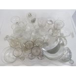 A large quantity of assorted glassware including; engraved champagne saucers, vegetable side dishes,