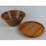 A large contemporary wooden fruit bowl together with a wooden lazy Susan, 39cm dia.