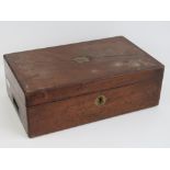A 19th century mahogany writing slope opening to reveal divided compartments and gilded leather