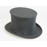 A collapsable fabric top hat by Lincoln Bennett & Co, Burlington Gardens, Old Bond Street, London.