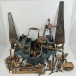 A quantity of vintage hand tools including a Record plane, files, saws,