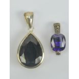 A silver pendant having large central faceted amethyst and bale set with marcasites, stamped 925, 2.