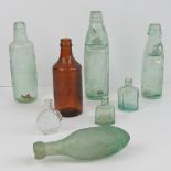 A selection of vintage glass bottles including; an EC Ashford Chemist 24 Old Street Northampton,