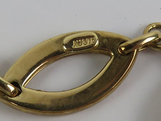 A 9ct gold bracelet having seven open oval shaped panels, hallmarked 375, 18. - Image 2 of 2