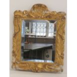 A single hand carved and gilded square shaped giltwood wall mirror having beveled glass, 45 x 34cm.