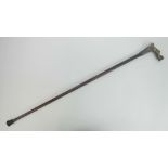 An Art Deco walking stick having brass female knop and measuring approx 93cm.