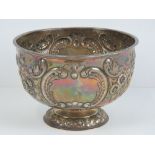 A HM silver bowl by William Hutton & Sons Ltd having repoussé floral decoration throughout, 16.